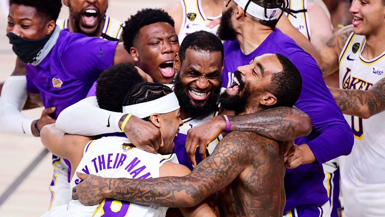 LAKE BUENA VISTA, FLORIDA - OCTOBER 11: LeBron James #23 of the Los Angeles Lakers celebrates with Quinn Cook #28 of the Los Angeles Lakers and teammates after winning the 2020 NBA Championship in Game Six of the 2020 NBA Finals at AdventHealth Arena at the ESPN Wide World Of Sports Complex on October 11, 2020 in Lake Buena Vista, Florida.
