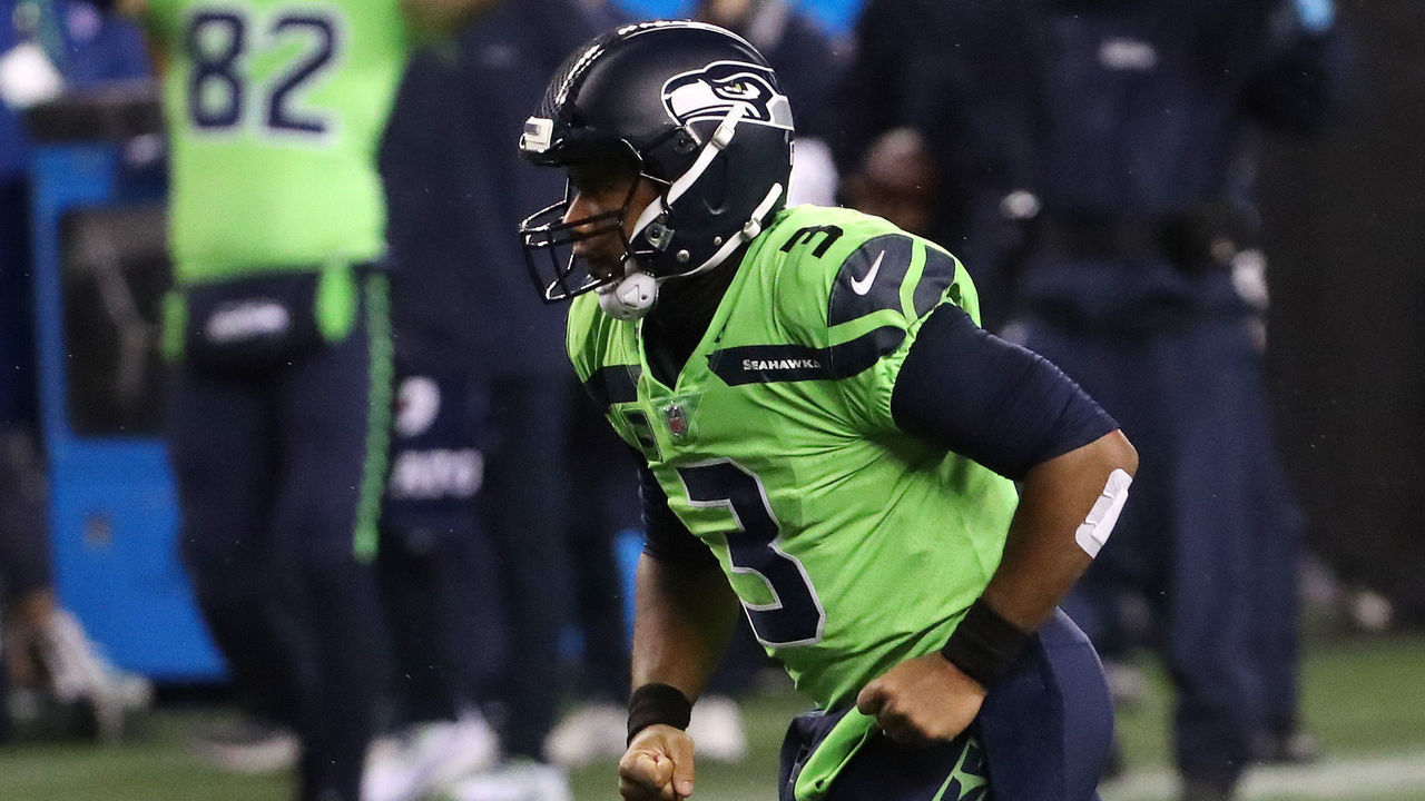 SEATTLE, WASHINGTON - OCTOBER 11: Russell Wilson #3 of the Seattle Seahawks celebrates a 13 yard touchdown pass to DK Metcalf #14 against the Minnesota Vikings during the third quarter at CenturyLink Field on October 11, 2020 in Seattle, Washington.