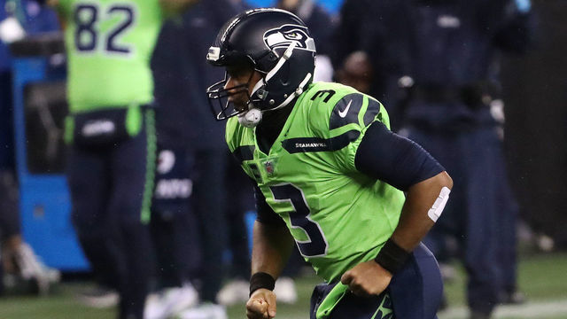 SEATTLE, WASHINGTON - OCTOBER 11: Russell Wilson #3 of the Seattle Seahawks celebrates a 13 yard touchdown pass to DK Metcalf #14 against the Minnesota Vikings during the third quarter at CenturyLink Field on October 11, 2020 in Seattle, Washington.