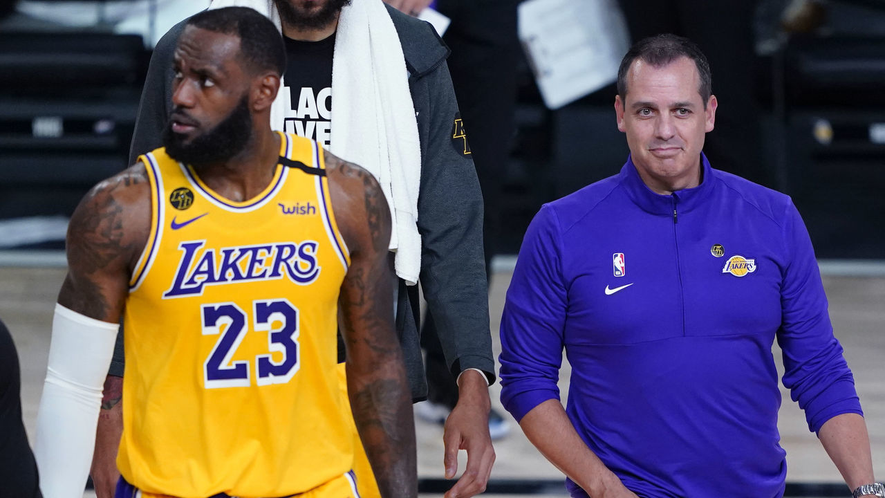 LAKE BUENA VISTA, FLORIDA - AUGUST 18: Head coach Frank Vogel and LeBron James #23 of the Los Angeles Lakers walk on the court during a timeout due to a goal being knocked out of position during action against the Portland Trail Blazers in the first half in Game 1 of Round 1 of the NBA Playoffs at AdventHealth Arena at ESPN Wide World Of Sports Complex on August 18, 2020 in Lake Buena Vista, Florida.