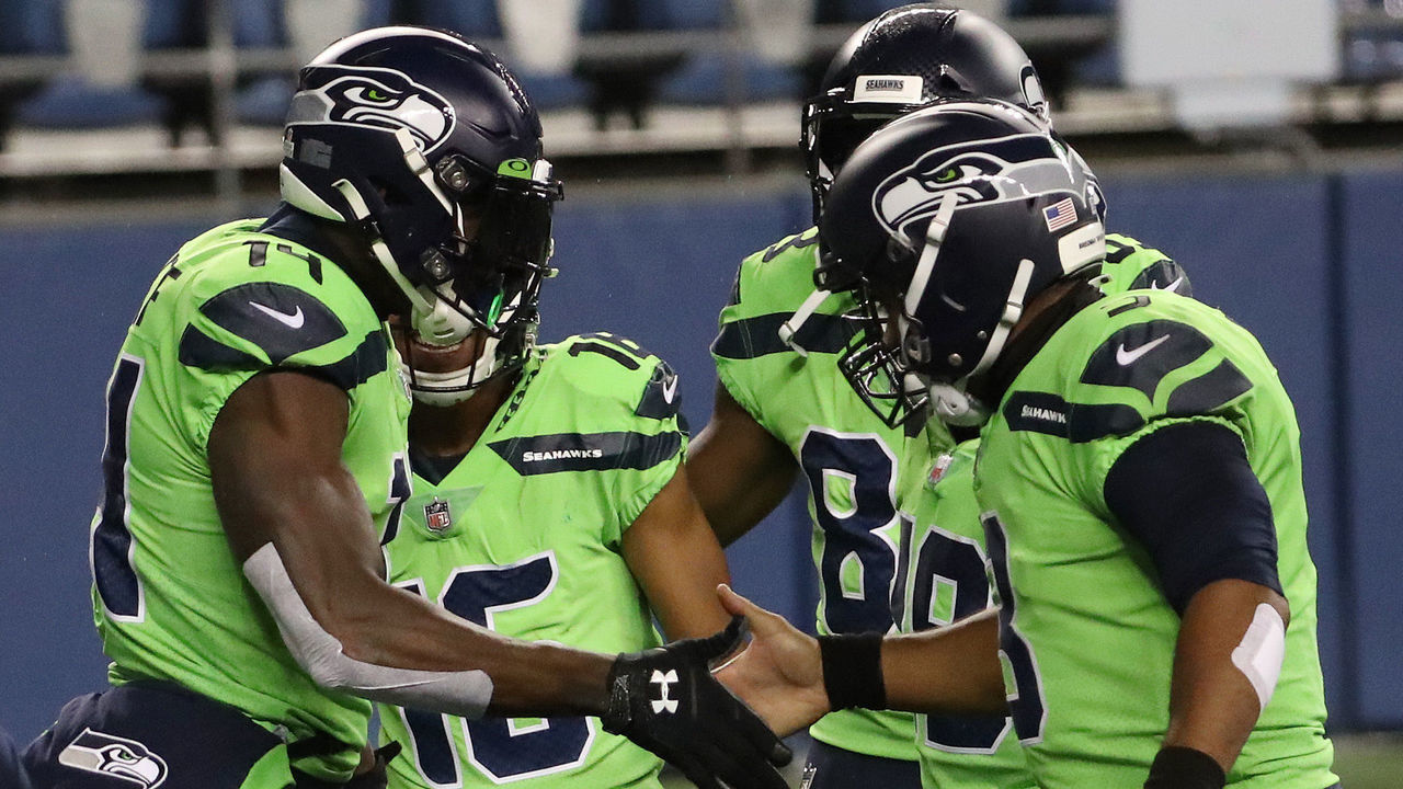 SEATTLE, WASHINGTON - OCTOBER 11: DK Metcalf #14 of the Seattle Seahawks celebrates his touchdown against the Minnesota Vikings with teammate Russell Wilson #3 during the third quarter at CenturyLink Field on October 11, 2020 in Seattle, Washington.
