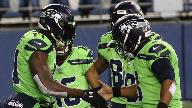 SEATTLE, WASHINGTON - OCTOBER 11: DK Metcalf #14 of the Seattle Seahawks celebrates his touchdown against the Minnesota Vikings with teammate Russell Wilson #3 during the third quarter at CenturyLink Field on October 11, 2020 in Seattle, Washington.