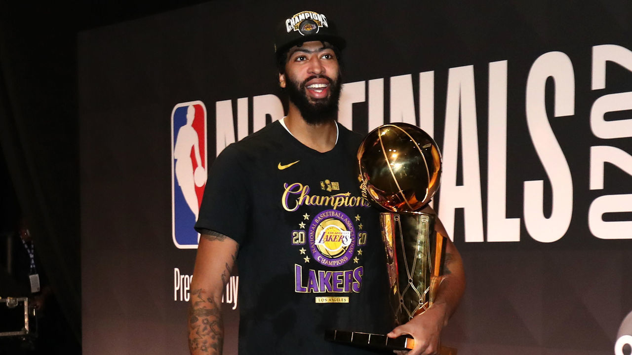 ORLANDO, FL - OCTOBER 11: Anthony Davis #3 of the Los Angeles Lakers walks off the court with the Larry O'Brien Championship Trophy after winning Game Six of the NBA Finals on October 11, 2020 at AdventHealth Arena in Orlando, Florida. NOTE TO USER: User expressly acknowledges and agrees that, by downloading and/or using this Photograph, user is consenting to the terms and conditions of the Getty Images License Agreement. Mandatory Copyright Notice: Copyright 2020 NBAE