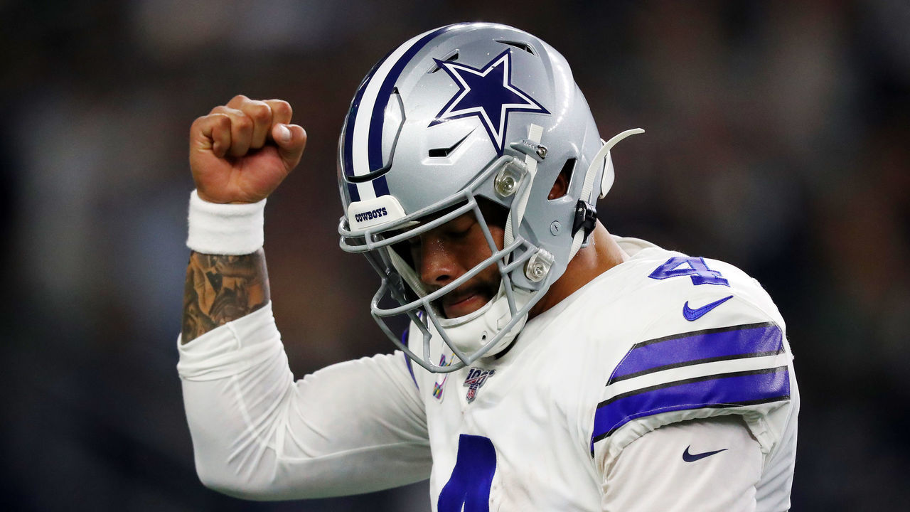 ARLINGTON, TEXAS - OCTOBER 20: Dak Prescott #4 of the Dallas Cowboys celebrates a first quarter touchdown against the Philadelphia Eagles in the game at AT&T Stadium on October 20, 2019 in Arlington, Texas.