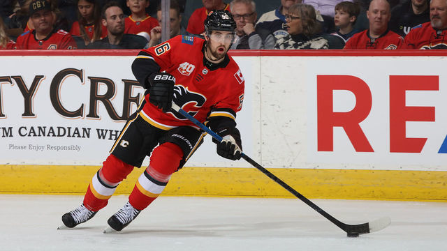 CALGARY, AB - MARCH 4: Erik Gustafsson #56 of the Calgary Flames plays the puck against the Columbus Blue Jackets at Scotiabank Saddledome on March 4, 2020 in Calgary, Alberta, Canada.