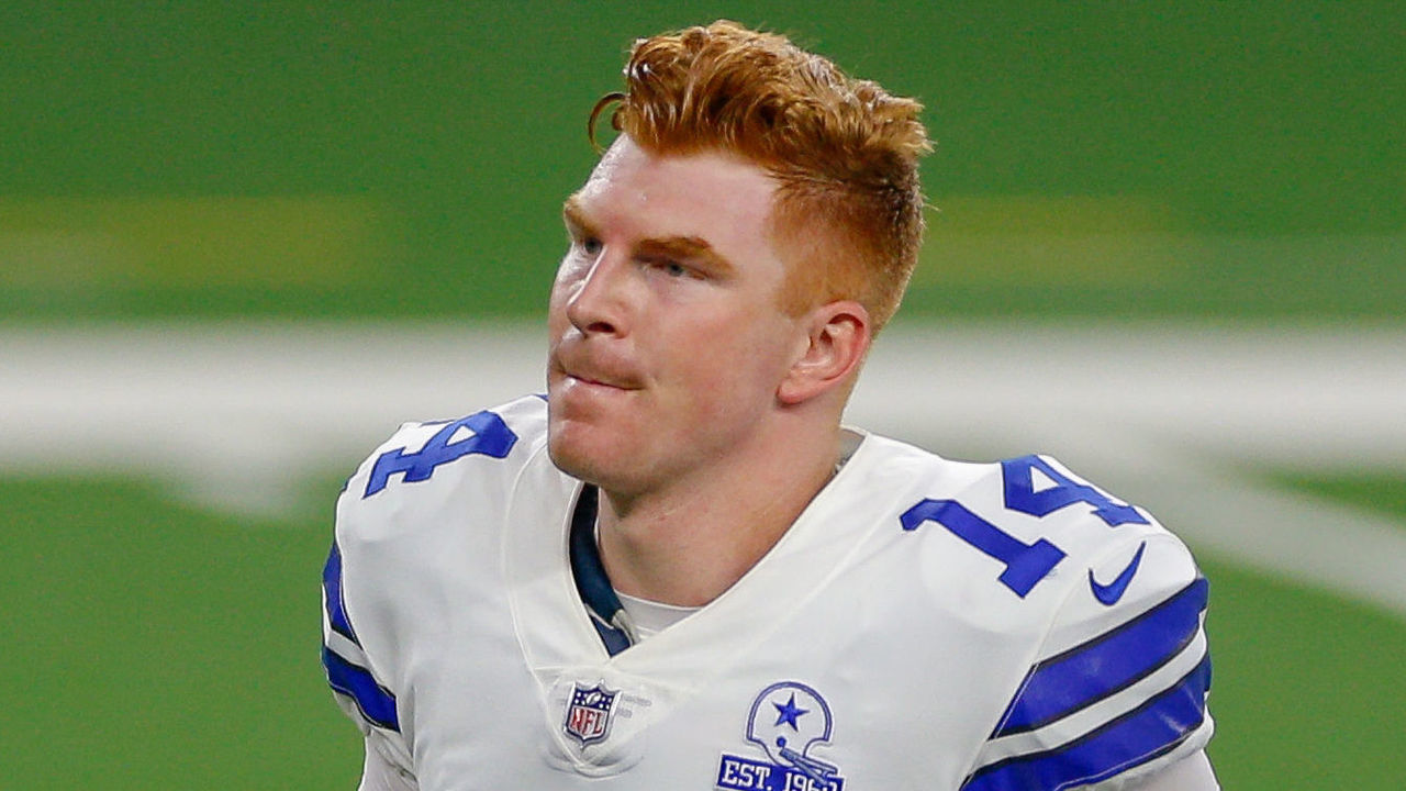 ARLINGTON, TX - OCTOBER 11: Dallas Cowboys Quarterback Andy Dalton (14) runs off the field after winning the NFL game between the New York Giants and Dallas Cowboys on October 11, 2020 at AT&T Stadium in Arlington, TX.
