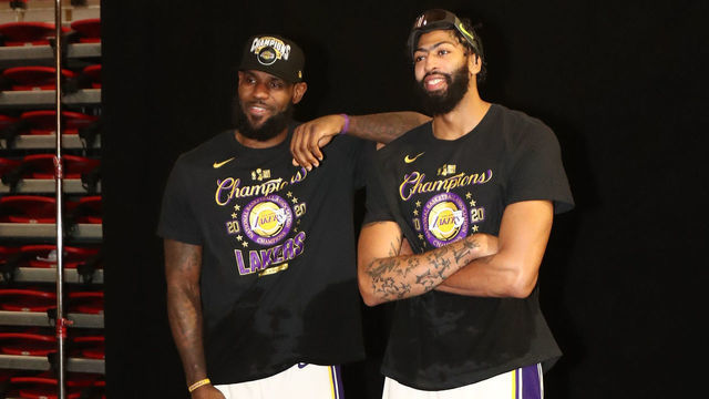 ORLANDO, FL - OCTOBER 11: LeBron James #23 and Anthony Davis #3 of the Los Angeles Lakers poses with the Larry O'Brien Trophy after winning Game Six of the NBA Finals on October 11, 2020 at AdventHealth Arena in Orlando, Florida. NOTE TO USER: User expressly acknowledges and agrees that, by downloading and/or using this Photograph, user is consenting to the terms and conditions of the Getty Images License Agreement. Mandatory Copyright Notice: Copyright 2020 NBAE