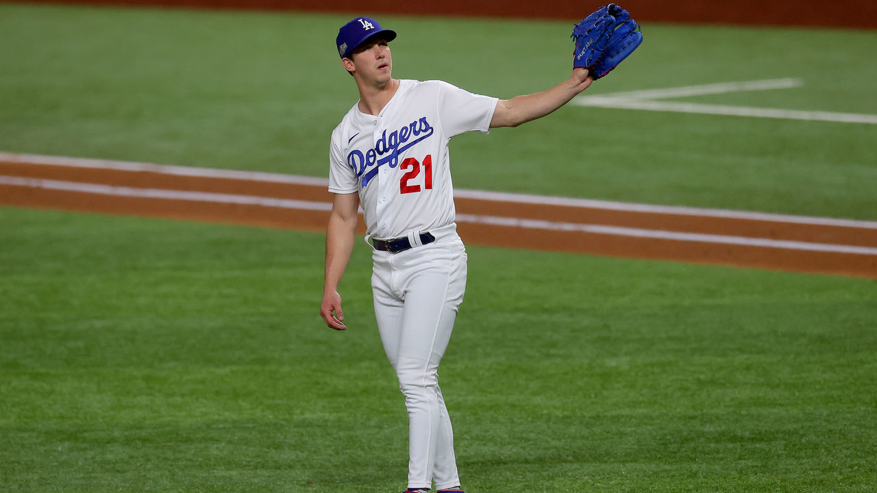 ARLINGTON, TEXAS - OCTOBER 12: Walker Buehler #21 of the Los Angeles Dodgers looks on against the Atlanta Braves during the second inning in Game One of the National League Championship Series at Globe Life Field on October 12, 2020 in Arlington, Texas.