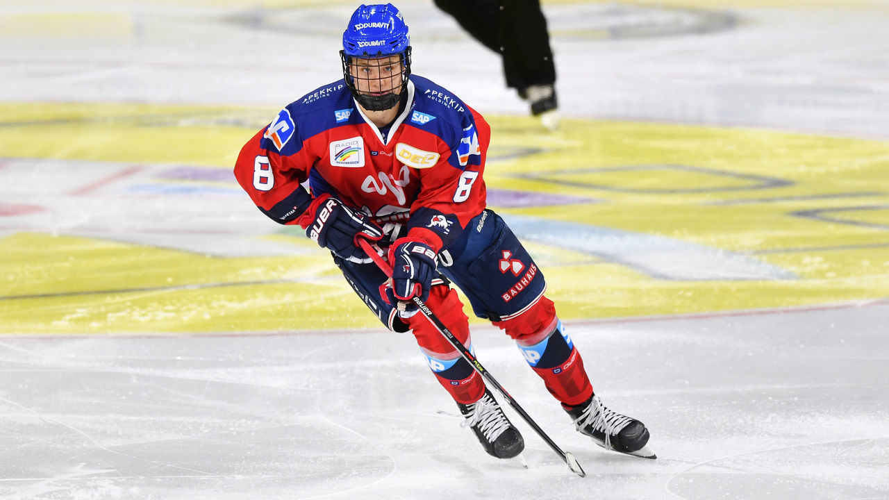 MANNHEIM, GERMANY - OCTOBER 18: Tim Stuetzle of the Adler Mannheim handles the puck during the action shot on october 18, 2019 in Mannheim, Germany.