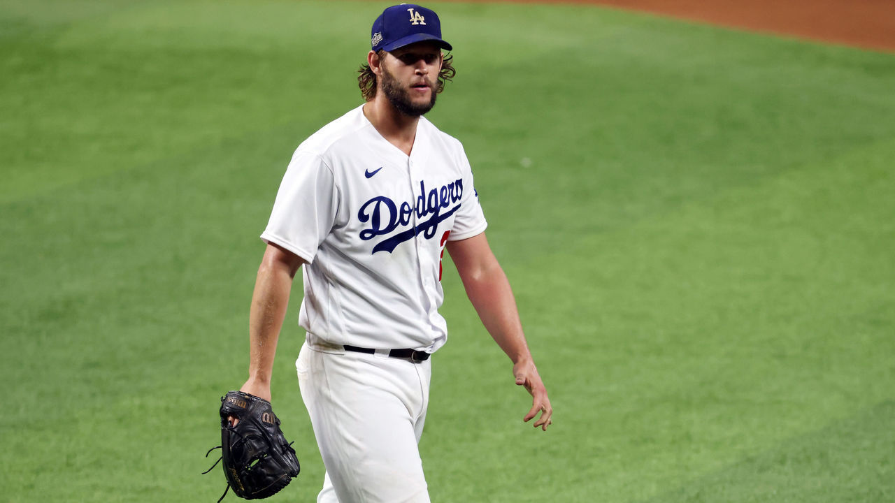 ARLINGTON, TEXAS - OCTOBER 07: Clayton Kershaw #22 of the Los Angeles Dodgers reacts as he walks to the dugout during the sixth inning against the San Diego Padres in Game Two of the National League Division Series at Globe Life Field on October 07, 2020 in Arlington, Texas.