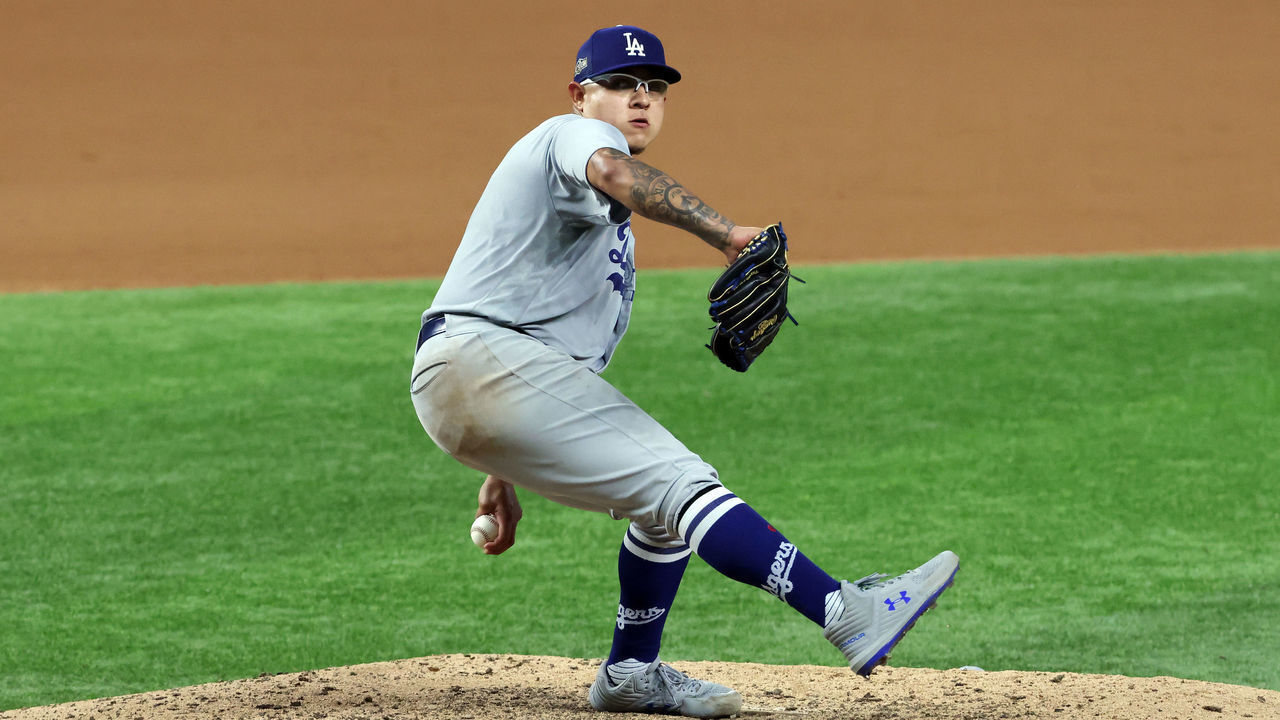 ARLINGTON, TEXAS - OCTOBER 08: Julio Urias #7 of the Los Angeles Dodgers pitches during the seventh inning against the San Diego Padres in Game Three of the National League Division Series at Globe Life Field on October 08, 2020 in Arlington, Texas.
