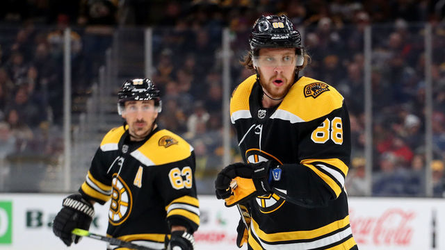 BOSTON, MASSACHUSETTS - DECEMBER 07: David Pastrnak #88 of the Boston Bruins and Brad Marchand #63 skate against the Colorado Avalanche during the third period at TD Garden on December 07, 2019 in Boston, Massachusetts. The Avalanche defeat the Bruins 4-1.