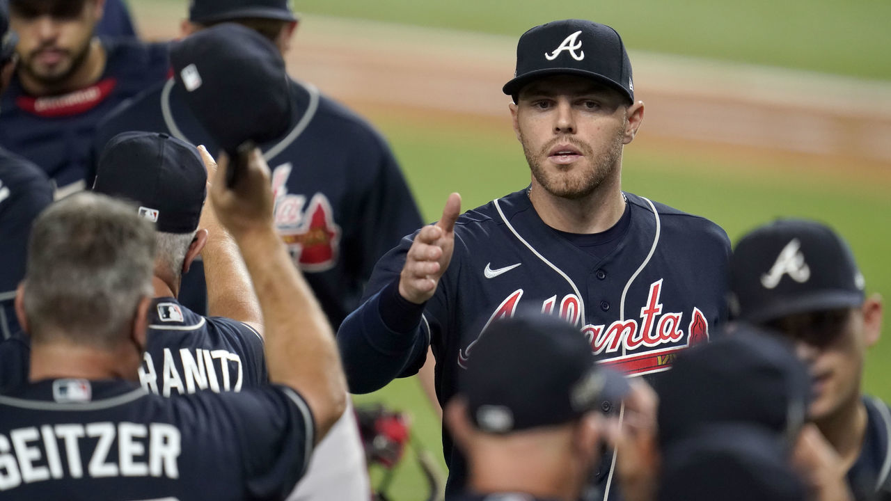 ARLINGTON, TX - OCTOBER 13: Freddie Freeman #5 of the Atlanta Braves celebrates after Game 2 of the NLCS between the Atlanta Braves and the Los Angeles Dodgers at Globe Life Field on Tuesday, October 13, 2020 in Arlington, Texas.
