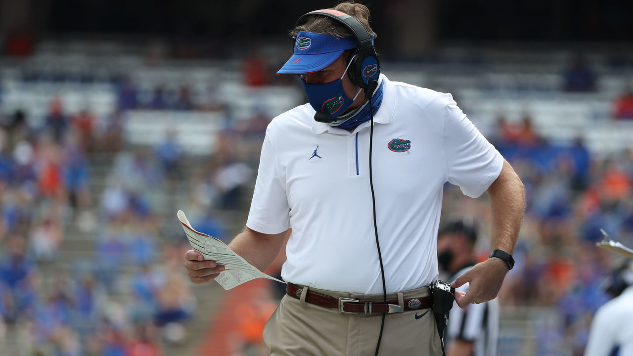 GAINESVILLE, FL - OCTOBER 3: Dan Mullen, Head Coach of the Florida Gators, looks for a play against the South Carolina Gamecocks on October 3, 2020 at Ben Hill Griffin Stadium in Gainesville, Florida.