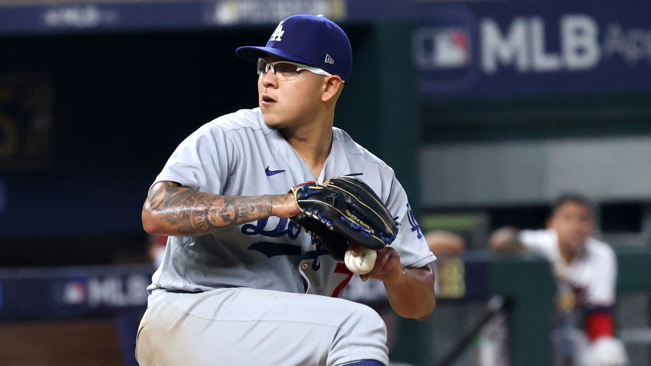 ARLINGTON, TEXAS - OCTOBER 14: Julio Urias #7 of the Los Angeles Dodgers delivers the pitch against the Atlanta Braves during the fourth inning in Game Three of the National League Championship Series at Globe Life Field on October 14, 2020 in Arlington, Texas.