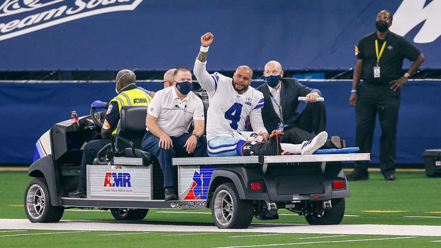 ARLINGTON, TX - OCTOBER 11: Dallas Cowboys Quarterback Dak Prescott (4) is carted off the field after suffering a leg injury during the NFL game between the New York Giants and Dallas Cowboys on October 11, 2020 at AT&T Stadium in Arlington, TX.