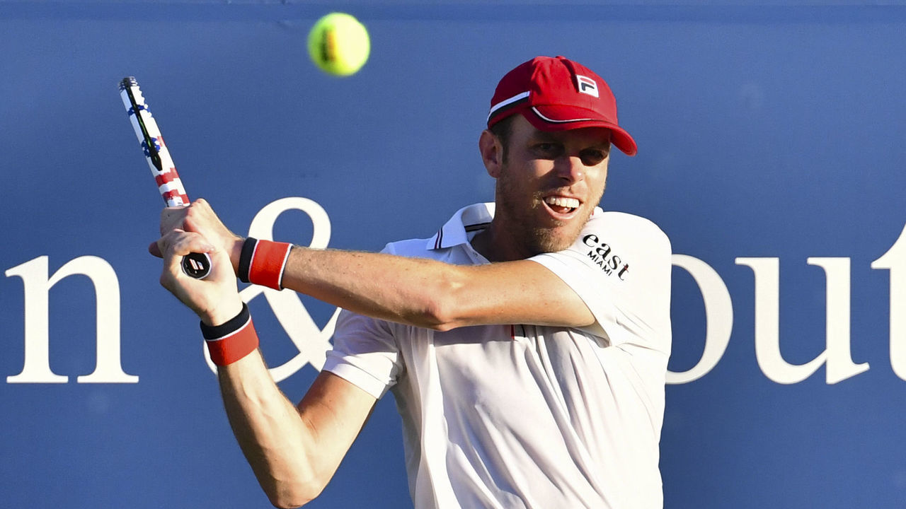 NEW YORK, NY - AUGUST 22: Sam Querrey of United States hits a backhand against Milos Raonic of Canada on Day 3 at the 2020 Western & Southern Open at the USTA Billie Jean King National Tennis Center on August 22, 2020 in the Queens borough of New York City.