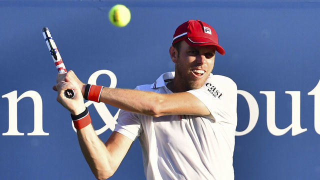 NEW YORK, NY - AUGUST 22: Sam Querrey of United States hits a backhand against Milos Raonic of Canada on Day 3 at the 2020 Western & Southern Open at the USTA Billie Jean King National Tennis Center on August 22, 2020 in the Queens borough of New York City.