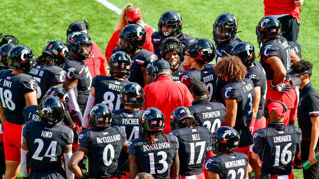 UC players huddle on the sidelines following a fumble recovery during an NCAA college football game at Nippert Stadium between the University of Cincinnati Bearcats and the University of South Florida. Cincinnati defeated USF 28-7. Saturday, October 3rd, 2020, in Cincinnati, Ohio, United States.