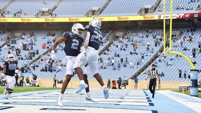 CHAPEL HILL, NORTH CAROLINA - OCTOBER 10: Dyami Brown #2 and Javonte Williams #25 of the North Carolina Tar Heels celebrate after a touchdown against the Virginia Tech Hokies during their game at Kenan Stadium on October 10, 2020 in Chapel Hill, North Carolina. North Carolina won 56-45.