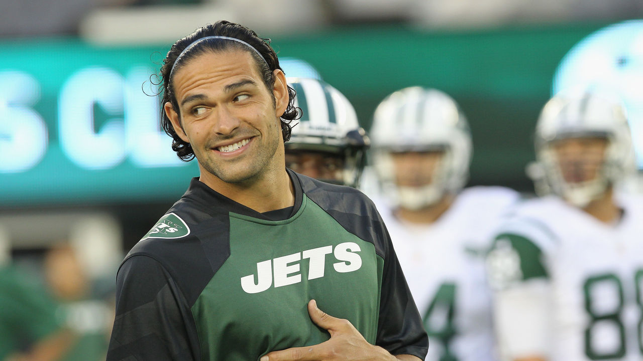 New York Jets Mark Sanchez takes off his helmet after greeting