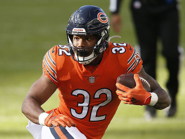 CHICAGO, IL - OCTOBER 04: Chicago Bears Running Back David Montgomery (32) looks to avoid Indianapolis Colts Cornerback Xavier Rhodes (27) during the NFL football game between the Indianapolis Colts and the Chicago Bears on October 4, 2020 at Soldier Field in Chicago, IL.