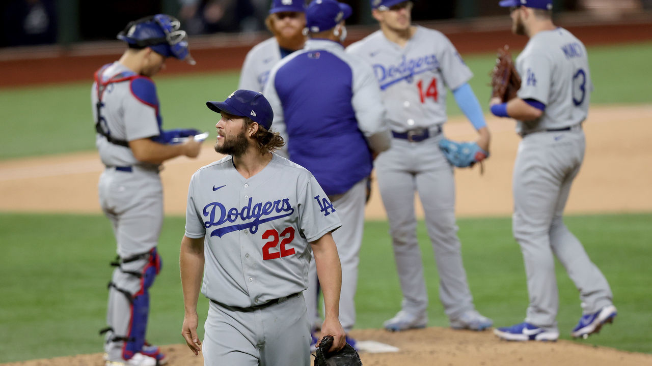 ARLINGTON, TEXAS - OCTOBER 15: Clayton Kershaw #22 of the Los Angeles Dodgers is taken out of the game against the Atlanta Braves during the sixth inning in Game Four of the National League Championship Series at Globe Life Field on October 15, 2020 in Arlington, Texas.