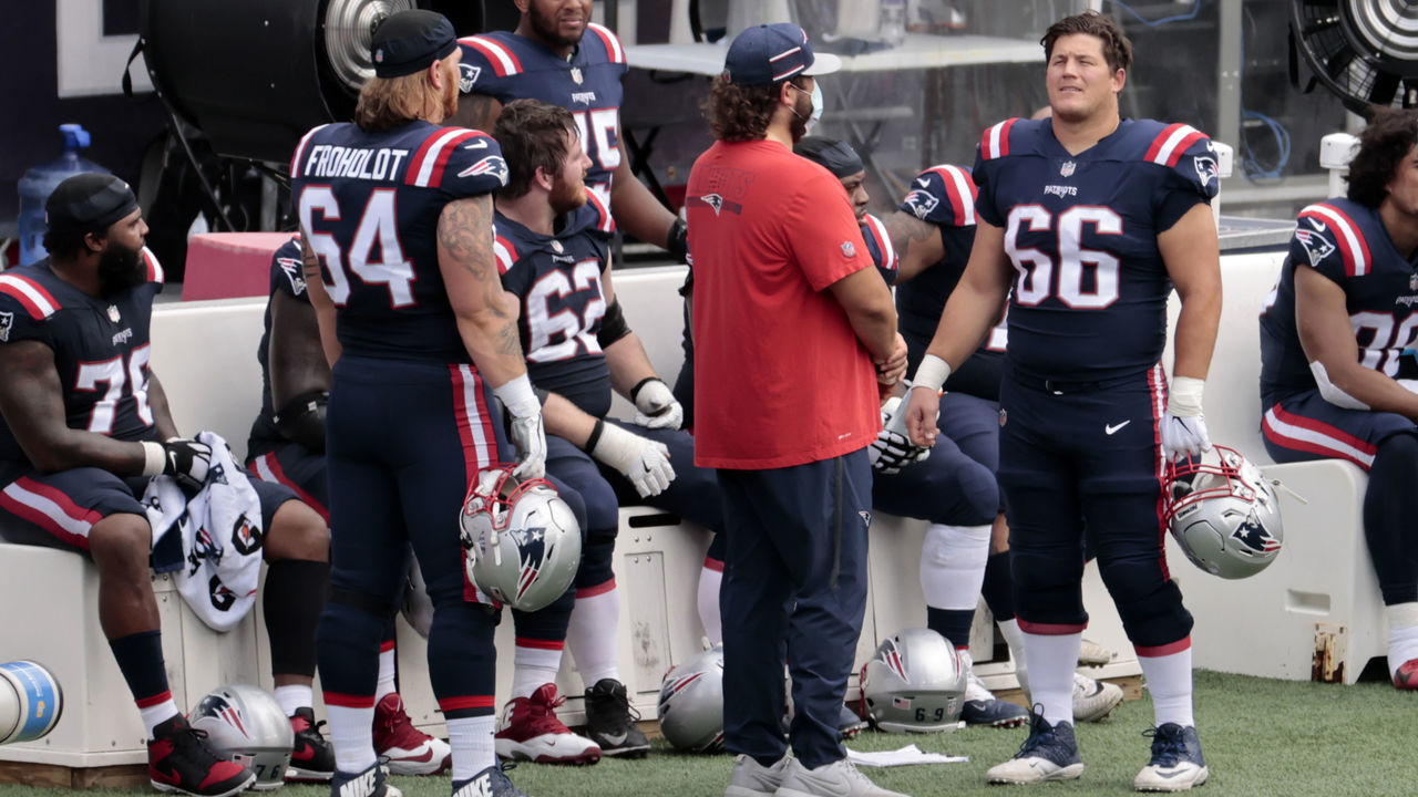 FOXBOROUGH, MA - SEPTEMBER 27: New England Patriots offensive lineman Hjalte Froholdt (64) an injured New England Patriots center David Andrews (60) and New England Patriots offensive lineman James Ferentz (66) during a game between the New England Patriots and the Las Vegas Raiders on September 27, 2020, at Gillette Stadium in Foxborough, Massachusetts.