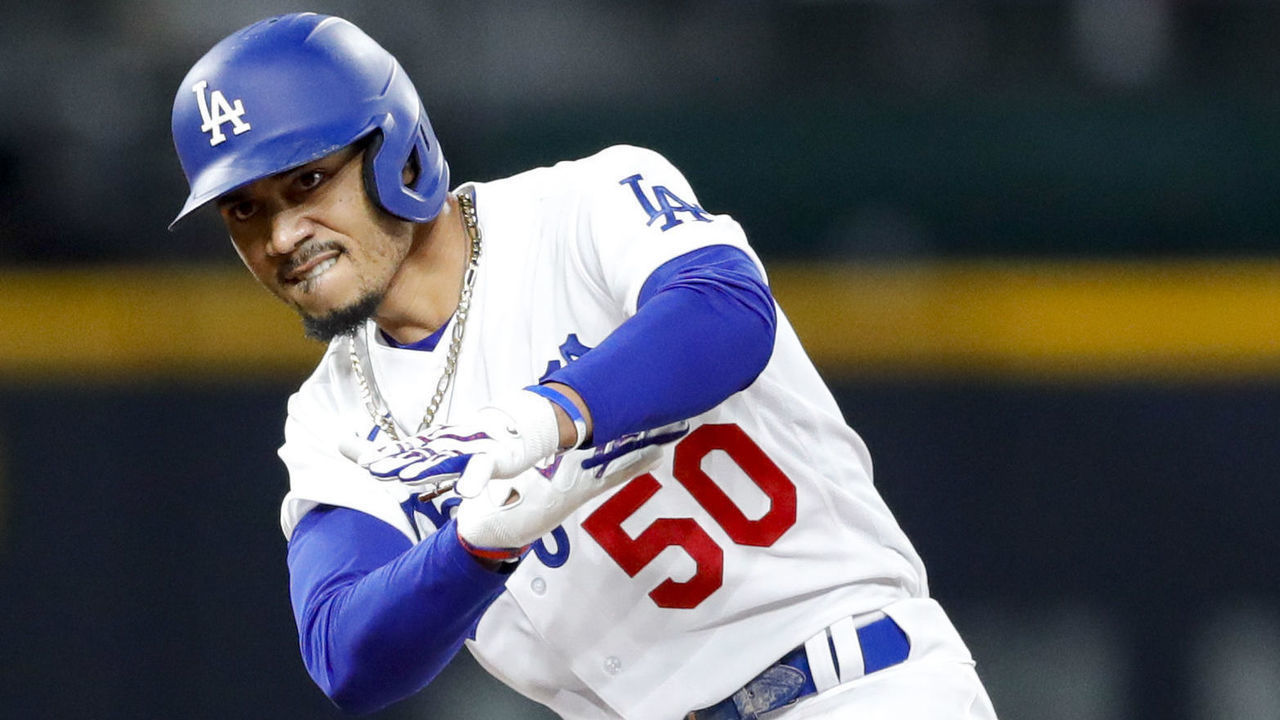 ARLINGTON, TX - OCTOBER 06: Mookie Betts #50 of the Los Angeles Dodgers celebrates during Game 1 of the NLDS between the Los Angeles Dodgers and the San Diego Padres at Globe Life Field on Tuesday, October 6, 2020 in Arlington, Texas.