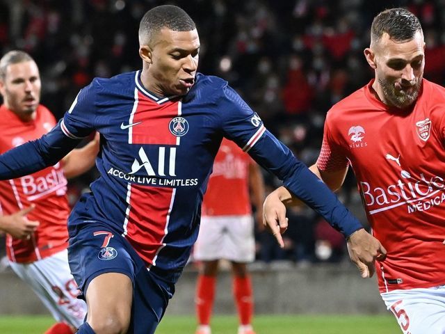 Paris Saint-Germain's French forward Kylian Mbappe (L) vies for the ball with Nimes' French defender Gaetan Paquiez during the French L1 football match between Nimes (NO) and Paris Saint Germain (PSG) at the Costieres Stadium in Nimes, southern France, on October 16, 2020.
