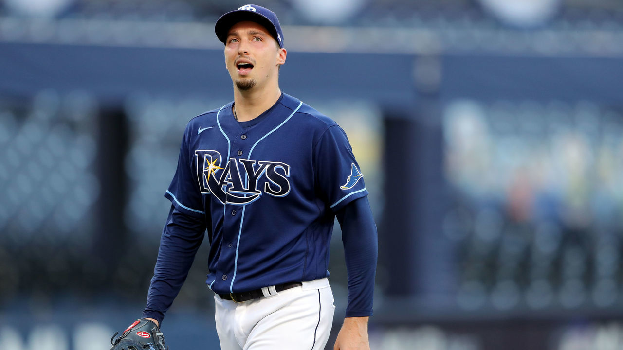 SAN DIEGO, CA - OCTOBER 16: Blake Snell #4 of the Tampa Bay Rays walks back to the dugout after a pitching change in the fifth inning during Game 6 of the ALCS between the Tampa Bay Rays and the Houston Astros at Petco Park on Friday, October 16, 2020 in San Diego, California.