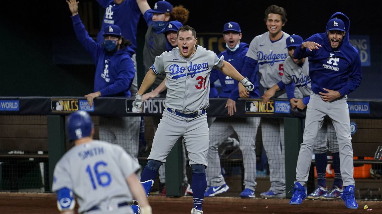 ARLINGTON, TX - OCTOBER 16: Will Smith #16 of the Los Angeles Dodgers rounds the bases as Joc Pederson #31 and the dugout celebrates after hitting a go-ahead three-run home run in the sixth inning during Game 5 of the NLCS between the Atlanta Braves and the Los Angeles Dodgers at Globe Life Field on Friday, October 16, 2020 in Arlington, Texas.