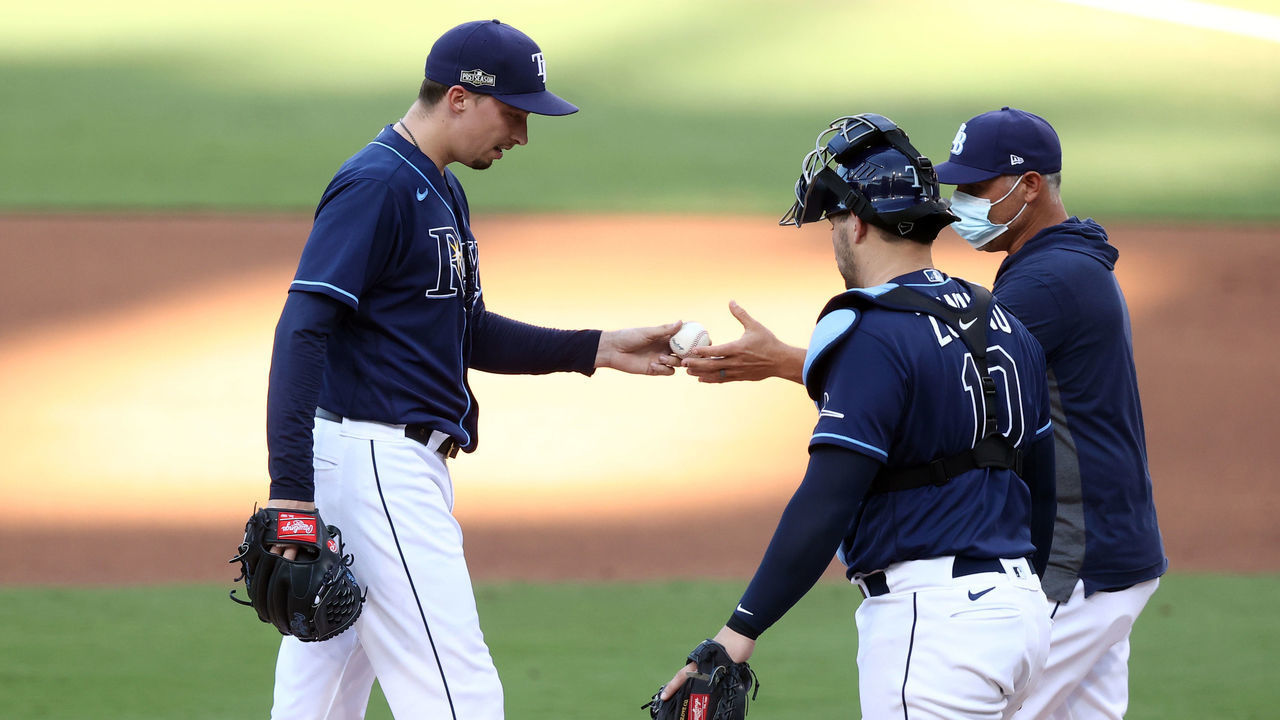 SAN DIEGO, CALIFORNIA - OCTOBER 16: Manager Kevin Cash #16 pulls Blake Snell #4 of the Tampa Bay Rays during the fifth inning against the Houston Astros in Game Six of the American League Championship Series at PETCO Park on October 16, 2020 in San Diego, California.
