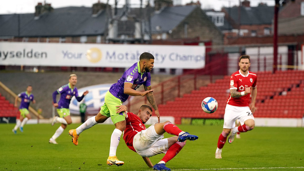 Bristol City's Nahki Wells (left) and Barnsley's Michal Helik battle for the ball during the Sky Bet Championship match at Oakwell, Barnsley.