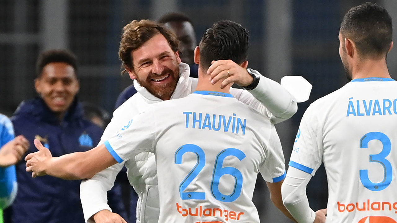 Marseille's French forward Florian Thauvin (C) celebrates with Marseille's Portuguese coach Andre Villas Boas after scoring a goal during the French L1 football match between Marseille and Bordeaux on October 17, 2020 at the Velodrome stadium in Marseille.