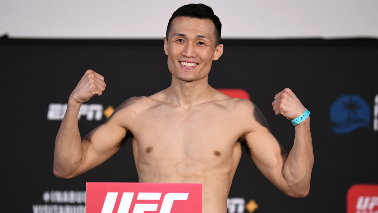ABU DHABI, UNITED ARAB EMIRATES - OCTOBER 16: "The Korean Zombie" Chan Sung Jung of South Korea poses on the scale during the UFC Fight Night weigh-in on October 16, 2020 on UFC Fight Island, Abu Dhabi, United Arab Emirates.
