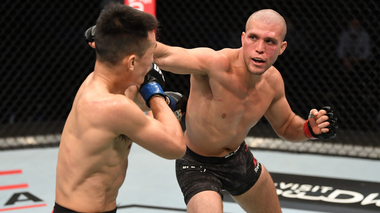 ABU DHABI, UNITED ARAB EMIRATES - OCTOBER 18: (R-L) Brian Ortega punches ‘The Korean Zombie’ Chan Sung Jung in their featherweight bout during the UFC Fight Night event inside Flash Forum on UFC Fight Island on October 18, 2020 in Abu Dhabi, United Arab Emirates.