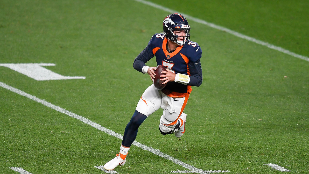 DENVER, CO - SEPTEMBER 14: Drew Lock #3 of the Denver Broncos rolls out of the pocket in the first quarter of a game against the Tennessee Titans at Empower Field at Mile High on September 14, 2020 in Denver, Colorado.