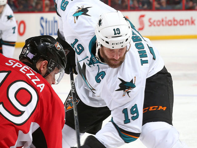 OTTAWA, ON - OCTOBER 27: Jason Spezza #19 of the Ottawa Senators faces off against Joe Thornton #19 of the San Jose Sharks at Canadian Tire Centre on October 27, 2013 in Ottawa, Ontario, Canada.