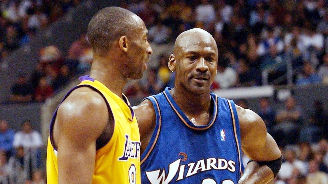 Los Angeles Lakers Kobe Bryant and Wizards Michael Jordan (R) during the second quarter action after Bryant scored 40 points in Los Angeles, CA, 28 March 2003. Gerard Burkhart