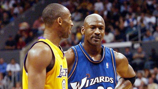Los Angeles Lakers Kobe Bryant and Wizards Michael Jordan (R) during the second quarter action after Bryant scored 40 points in Los Angeles, CA, 28 March 2003. Gerard Burkhart