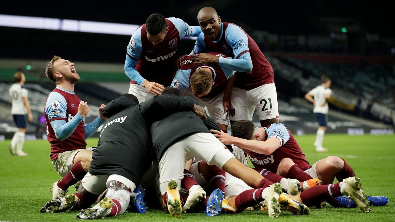 West Ham players celebrate after West Ham United's Argentinian midfielder Manuel Lanzini (unseen) scored their thrid goal during the English Premier League football match between Tottenham Hotspur and West Ham United at Tottenham Hotspur Stadium in London, on October 18, 2020.