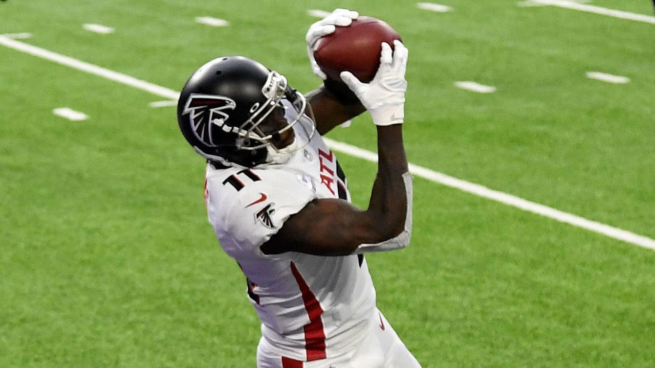 MINNEAPOLIS, MINNESOTA - OCTOBER 18: Julio Jones #11 of the Atlanta Falcons scores a touchdown past Harrison Smith #22 and Cameron Dantzler #27 of the Minnesota Vikings at U.S. Bank Stadium on October 18, 2020 in Minneapolis, Minnesota.
