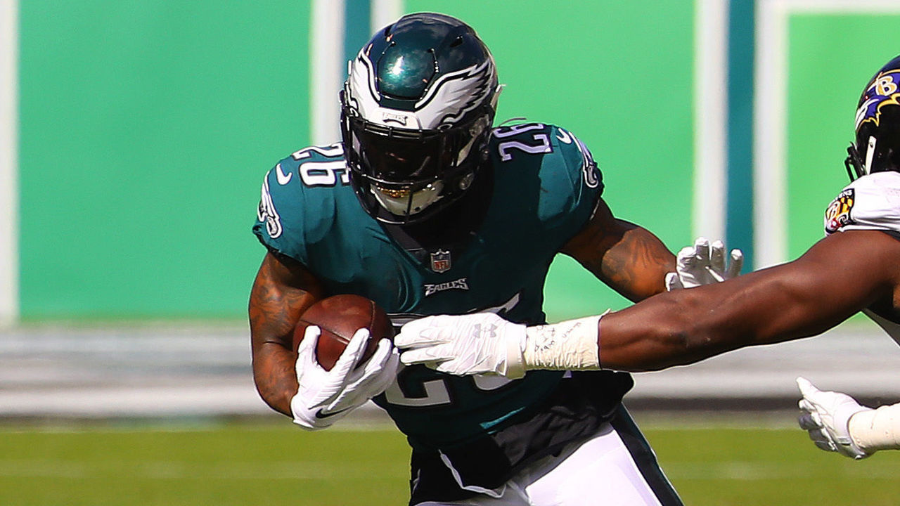 PHILADELPHIA, PENNSYLVANIA - OCTOBER 18: Miles Sanders #26 of the Philadelphia Eagles runs for a four yard gain against Pernell McPhee #90 of the Baltimore Ravens during the first quarter at Lincoln Financial Field on October 18, 2020 in Philadelphia, Pennsylvania.