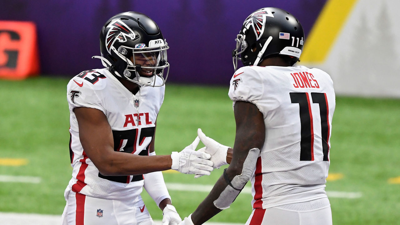 MINNEAPOLIS, MINNESOTA - OCTOBER 18: Russell Gage #83 and Julio Jones #11 of the Atlanta Falcons celebrate after Jones scored a touchdown in the third quarter against the Minnesota Vikings at U.S. Bank Stadium on October 18, 2020 in Minneapolis, Minnesota.