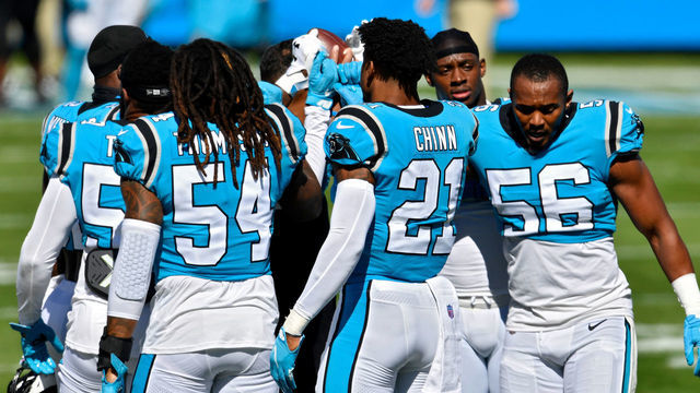 CHARLOTTE, NORTH CAROLINA - OCTOBER 18: Members of the Carolina Panthers huddle before the game at Bank of America Stadium on October 18, 2020 in Charlotte, North Carolina.
