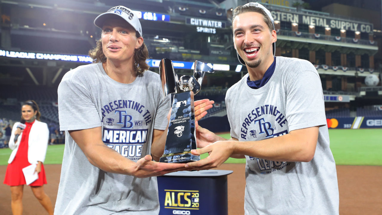 SAN DIEGO, CA - OCTOBER 17: Tyler Glasnow #20 and Blake Snell #4 of the Tampa Bay Rays hold the American League Champions trophy during the trophy presentation after the Tampa Bay Rays win Game 7 of the ALCS 4-2 against the Houston Astros at Petco Park on Saturday, October 17, 2020 in San Diego, California.
