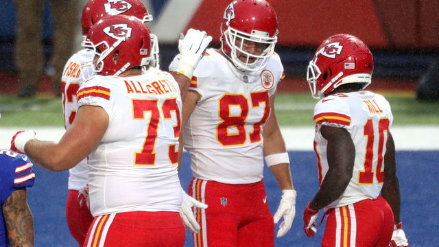 ORCHARD PARK, NEW YORK - OCTOBER 19: Travis Kelce #87 of the Kansas City Chiefs is congratulated by his teammates after scoring a touchdown reception against the Buffalo Bills during the first half at Bills Stadium on October 19, 2020 in Orchard Park, New York.