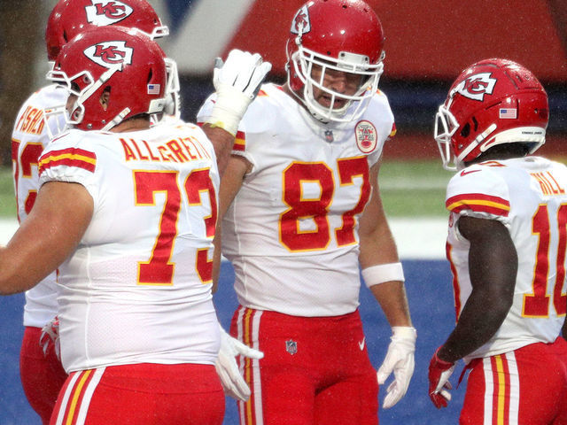 ORCHARD PARK, NEW YORK - OCTOBER 19: Travis Kelce #87 of the Kansas City Chiefs is congratulated by his teammates after scoring a touchdown reception against the Buffalo Bills during the first half at Bills Stadium on October 19, 2020 in Orchard Park, New York.