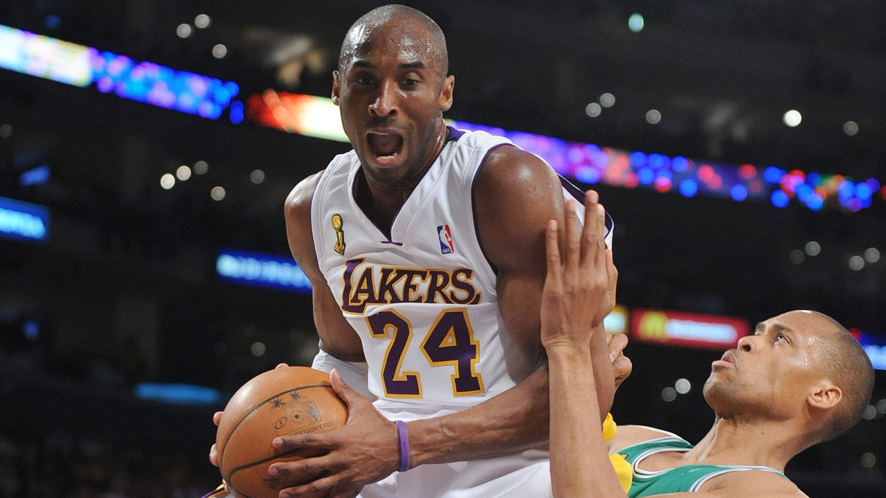 Laker Kobe Bryant gets an offensive rebound over Boston's Kendrick Perkins in firswt quarter action in game 5 of the NBA finals at Staples Center in Los Angeles, CA Sunday, June 15, 2008.